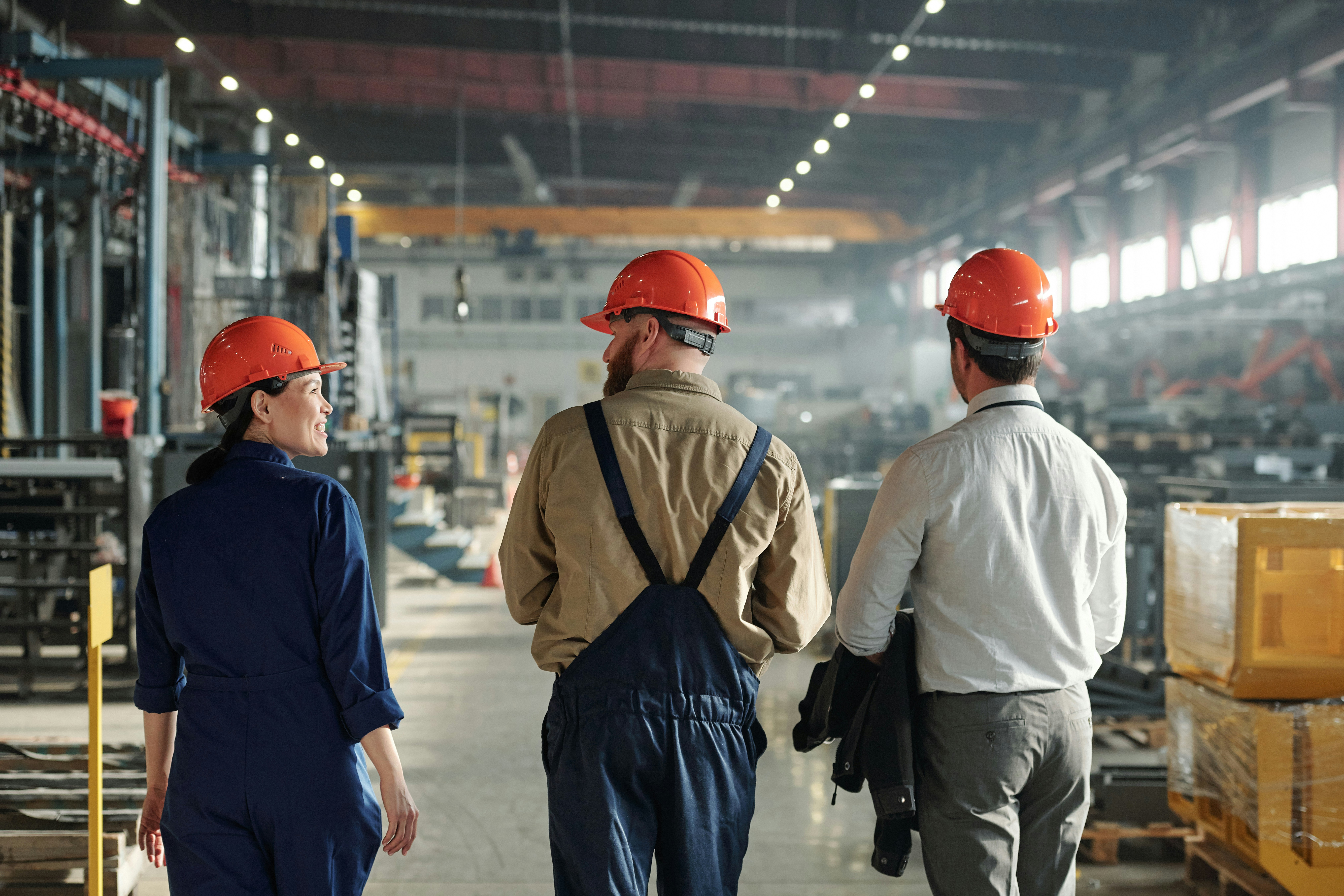Workers walking through a manufacturing facility